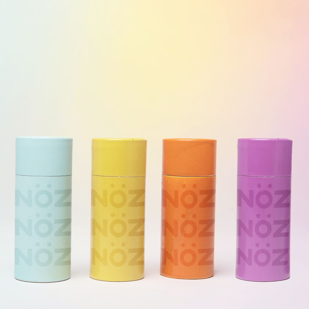 Blue, Yellow, Orange, and purple Noz sunscreens lined up